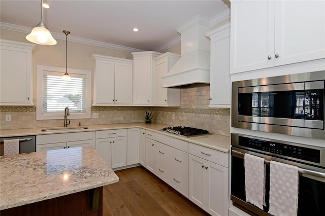 kitchen with sink, white cabinets, and stainless steel appliances