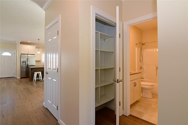 corridor featuring light hardwood / wood-style floors