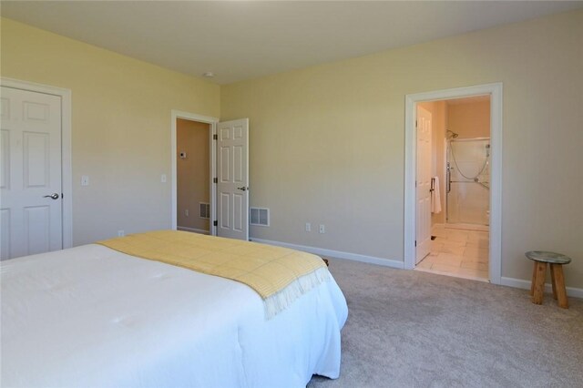 carpeted bedroom with ensuite bathroom