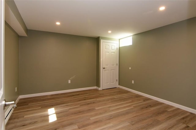 spare room with wood-type flooring