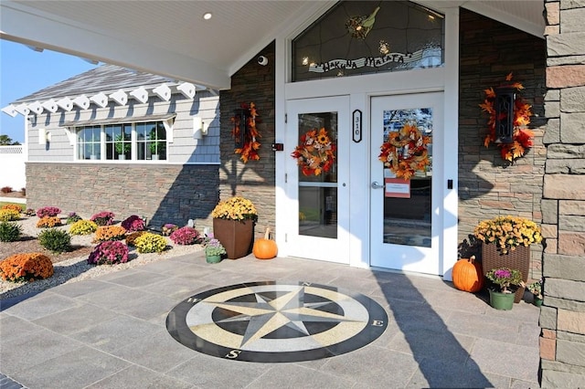 view of exterior entry featuring french doors