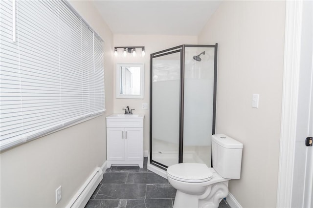 bathroom with toilet, a shower with door, and vanity