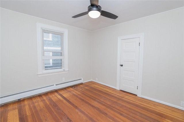 empty room with ceiling fan, hardwood / wood-style flooring, and a baseboard radiator