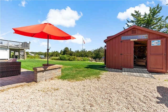 view of yard with a patio and a shed