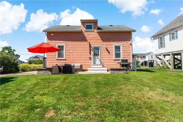 back of house with a lawn