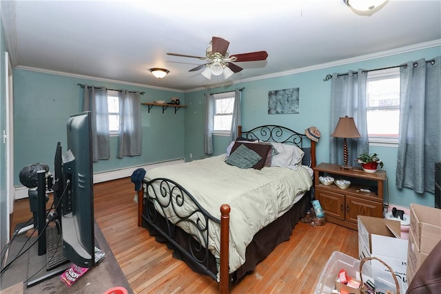 bedroom featuring ceiling fan, light hardwood / wood-style floors, multiple windows, and ornamental molding