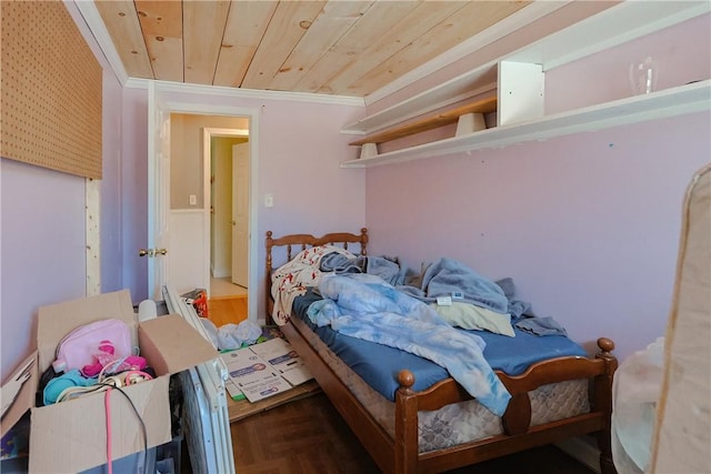 bedroom with wood ceiling, parquet floors, and ornamental molding