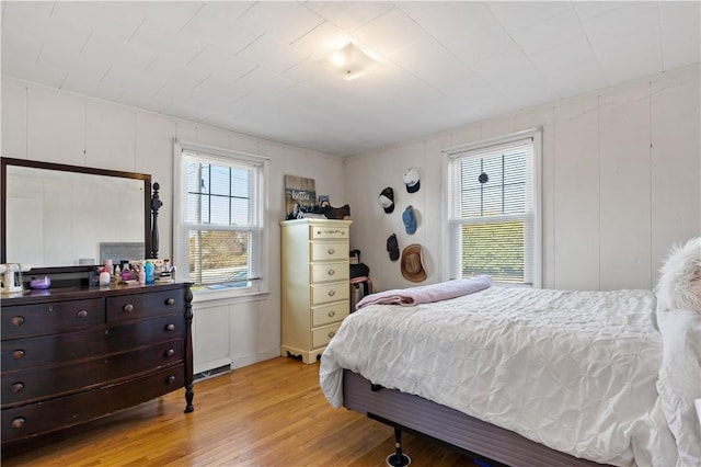 bedroom with light hardwood / wood-style floors