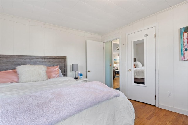 bedroom with hardwood / wood-style floors