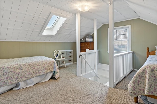 bedroom featuring carpet floors and lofted ceiling with skylight