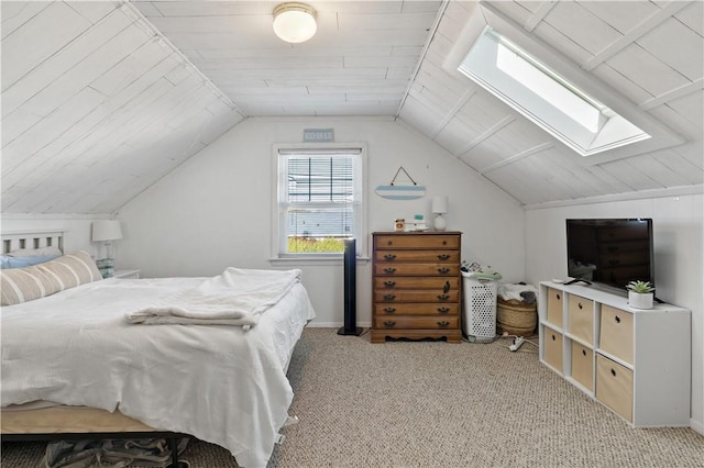 bedroom with wooden ceiling, light colored carpet, and lofted ceiling with skylight