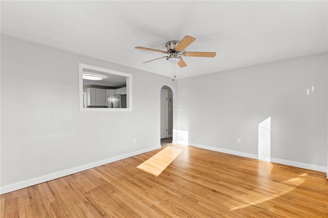 spare room with ceiling fan and light hardwood / wood-style flooring