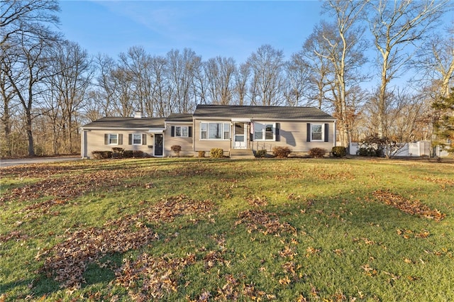 single story home with a front yard