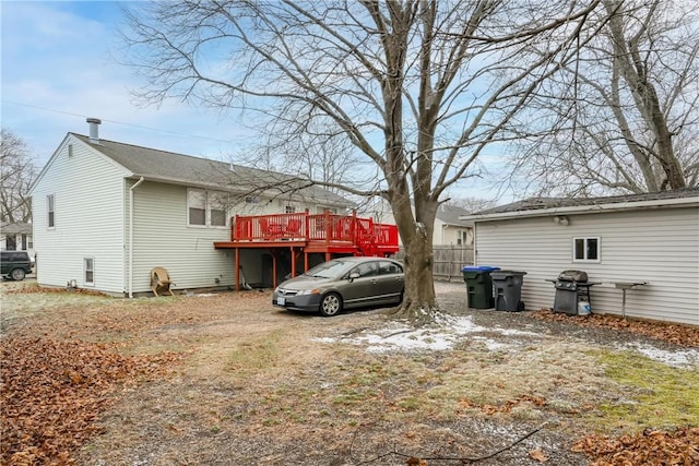 view of side of property with a wooden deck