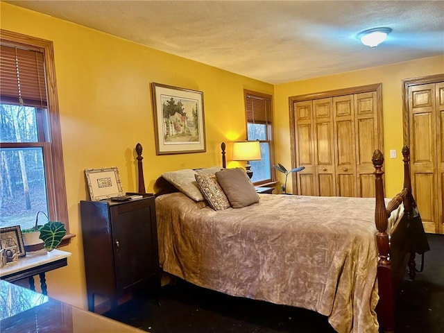 bedroom with a textured ceiling and a closet