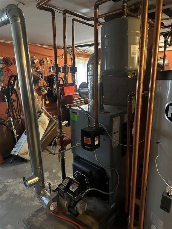 utility room with water heater