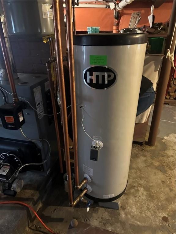 utility room featuring water heater