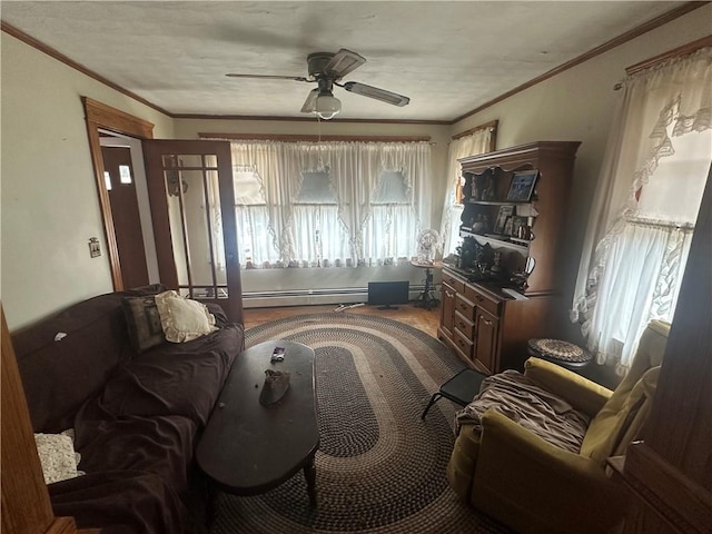 sitting room with baseboard heating, crown molding, and ceiling fan