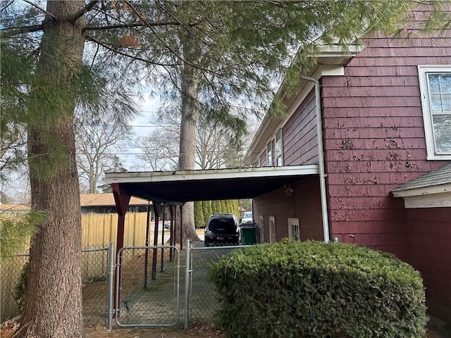 view of side of property with a carport