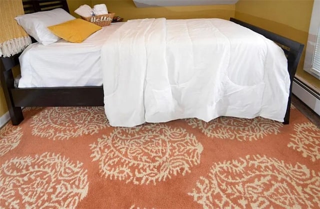 bedroom featuring a baseboard heating unit