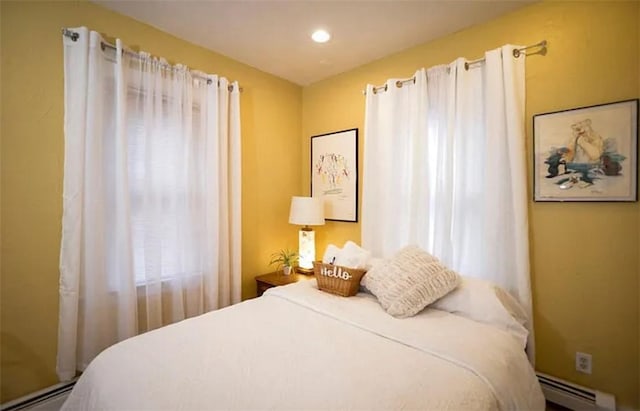 bedroom featuring a baseboard heating unit