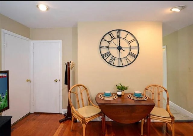 dining space featuring hardwood / wood-style flooring