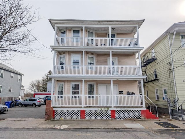 view of front of house with a balcony and a porch