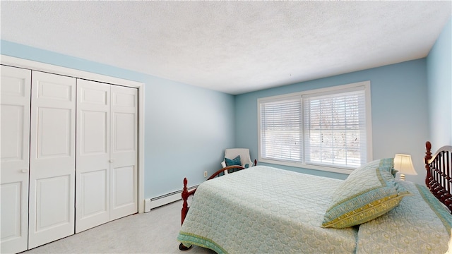 carpeted bedroom with a baseboard radiator, a closet, and a textured ceiling