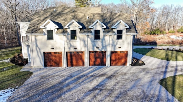 garage featuring a yard