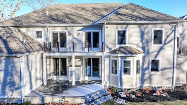 rear view of house with a balcony