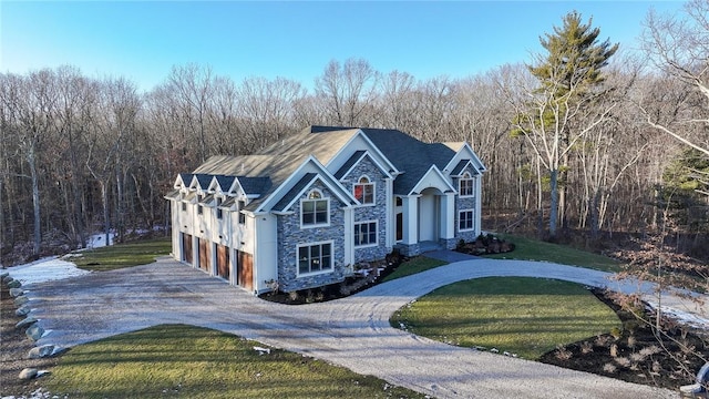 view of front facade with a garage and a front yard