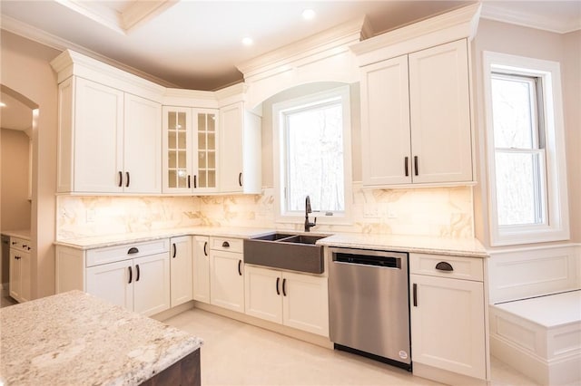 kitchen with sink, white cabinetry, and stainless steel dishwasher