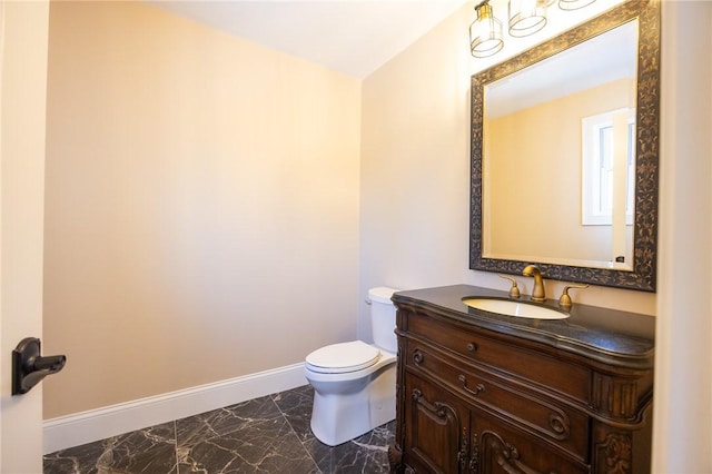 bathroom with toilet and vanity