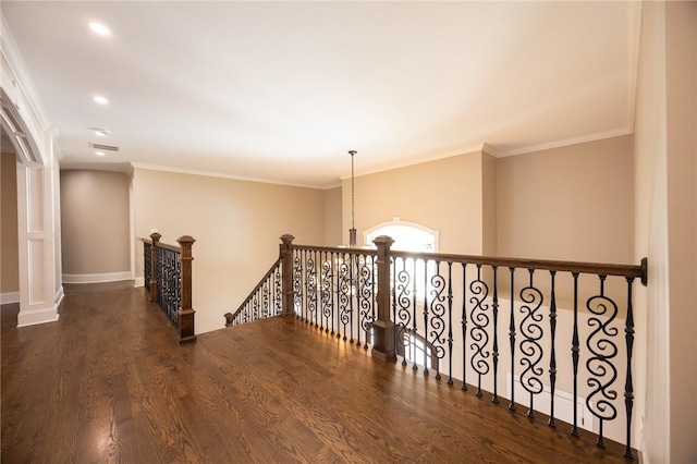 hall with dark hardwood / wood-style flooring and ornamental molding