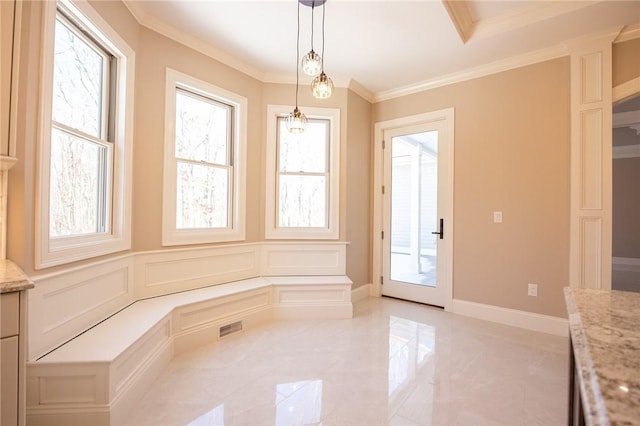 unfurnished dining area with ornamental molding and a notable chandelier