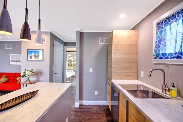 kitchen featuring dishwasher, pendant lighting, sink, ornamental molding, and dark hardwood / wood-style flooring