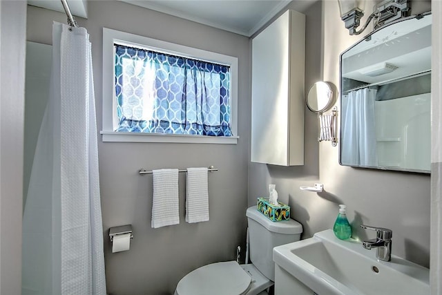 bathroom featuring sink and toilet