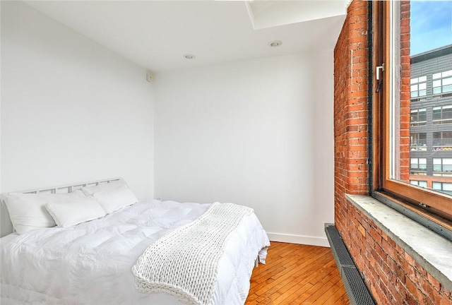 bedroom with light hardwood / wood-style flooring