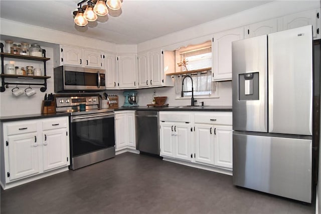 kitchen featuring sink, white cabinetry, and stainless steel appliances