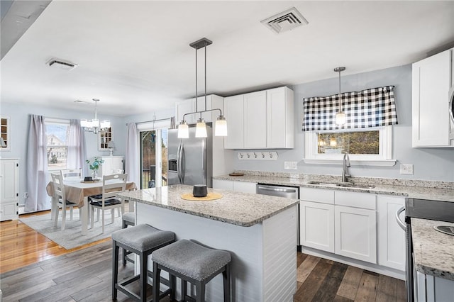 kitchen featuring sink, white cabinets, and stainless steel appliances