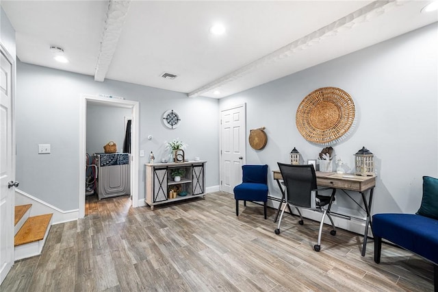 office featuring beam ceiling and hardwood / wood-style floors