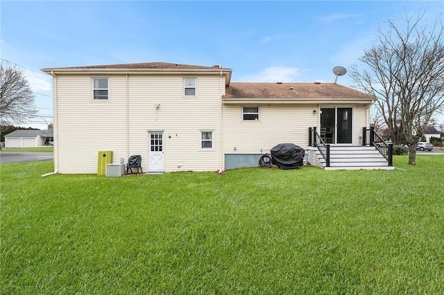 rear view of property featuring a yard