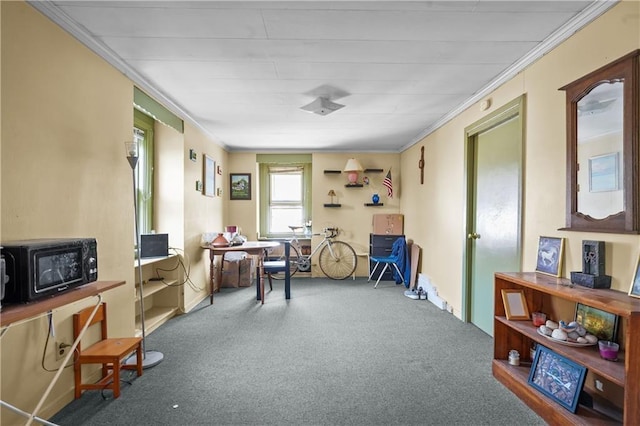 miscellaneous room featuring ornamental molding and carpet flooring