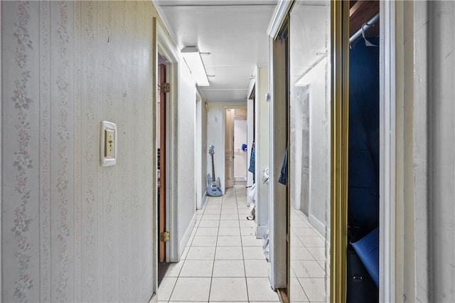 hall with light tile patterned floors