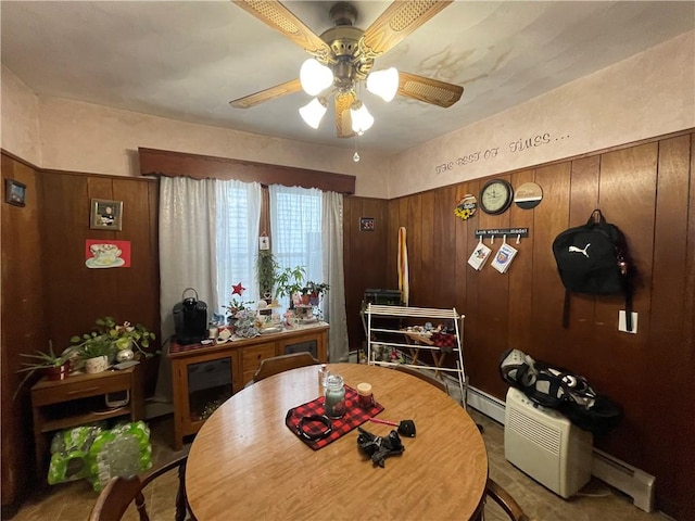 dining space with ceiling fan and a baseboard radiator