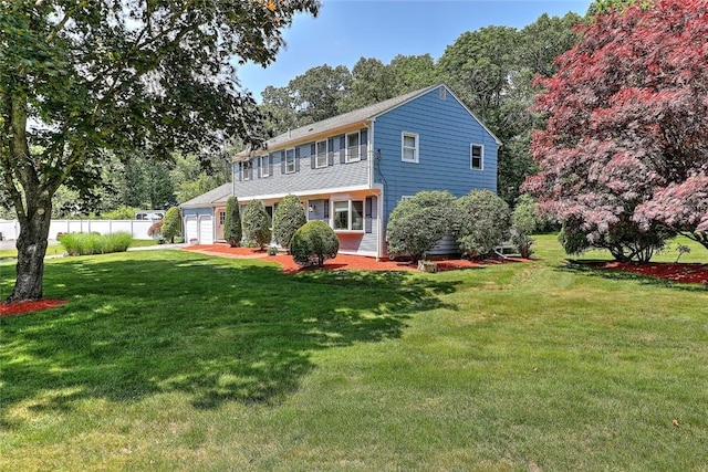 exterior space with a front lawn and a garage