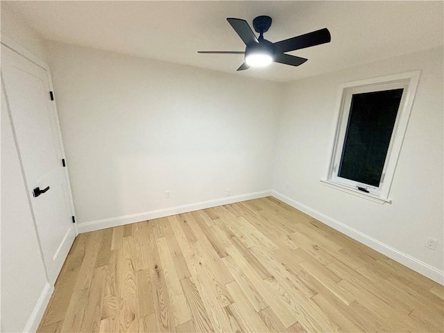 spare room featuring ceiling fan and light hardwood / wood-style flooring