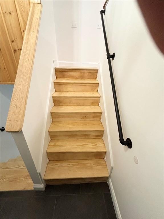 stairs with tile patterned floors