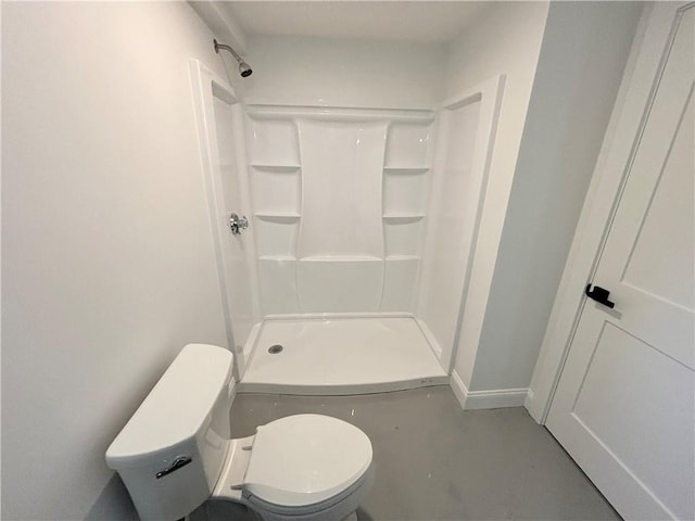 bathroom with a shower and toilet