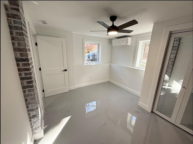 interior space featuring ceiling fan, a closet, and a wall mounted air conditioner